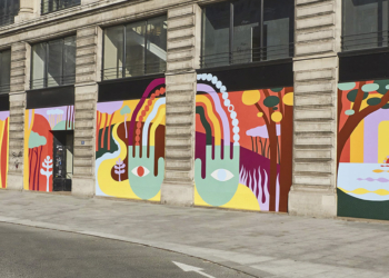 Artista pinta fachada da sede da Louis Vuitton com intervenção colorida